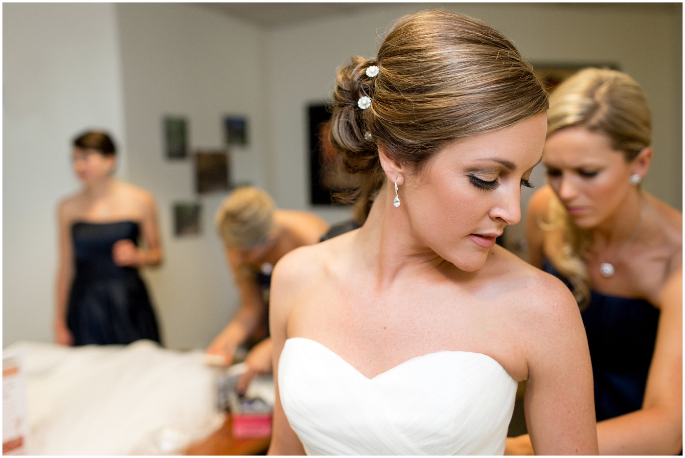 picture of bride getting in her dress