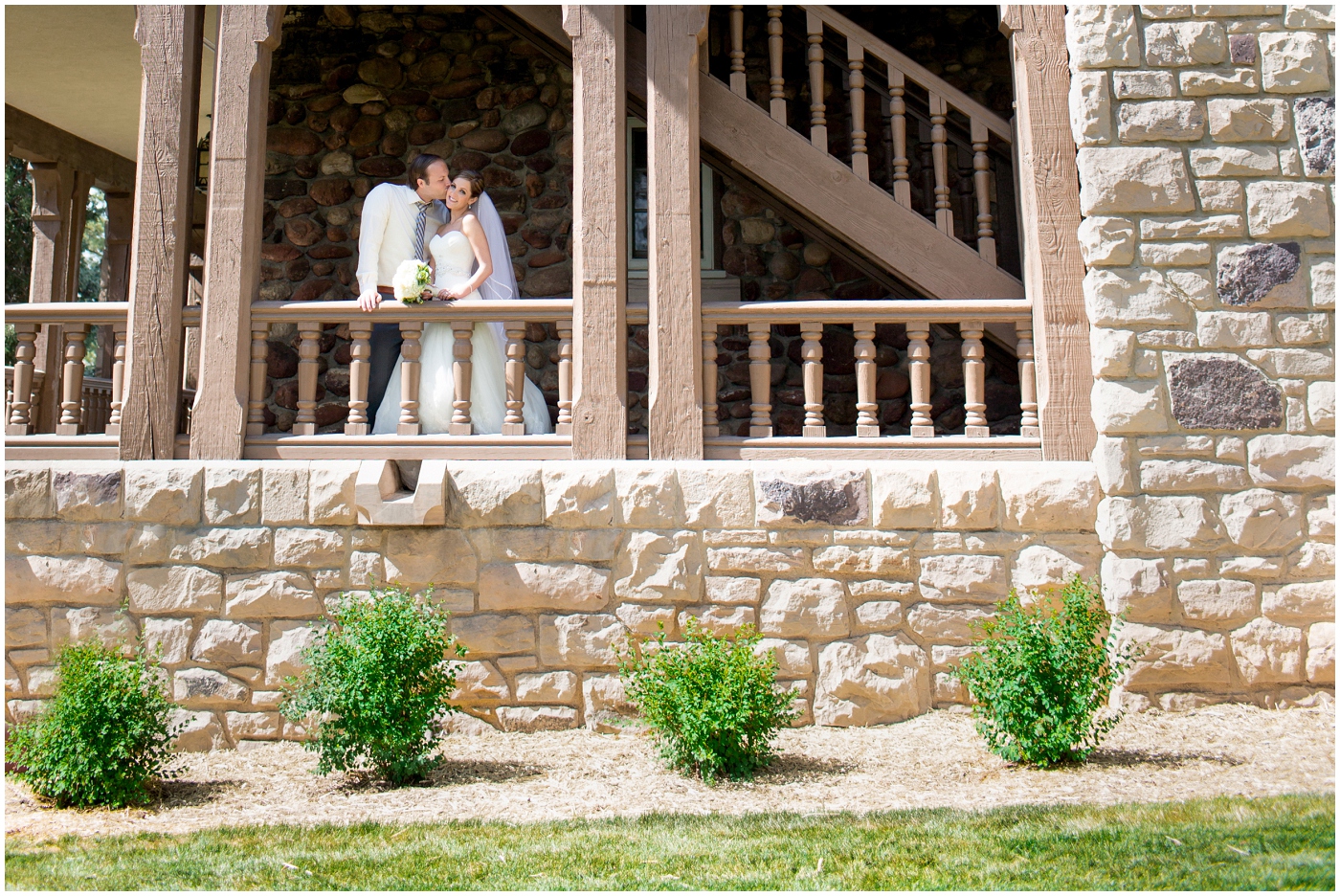 picture of bride and groom on balcony