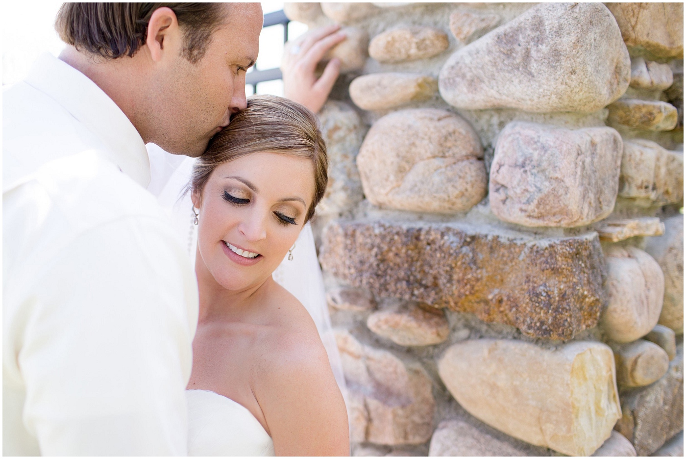 picture of bride and groom kissing