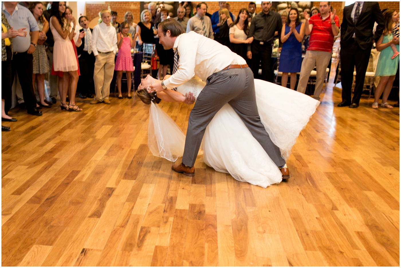 picture of groom dipping bride