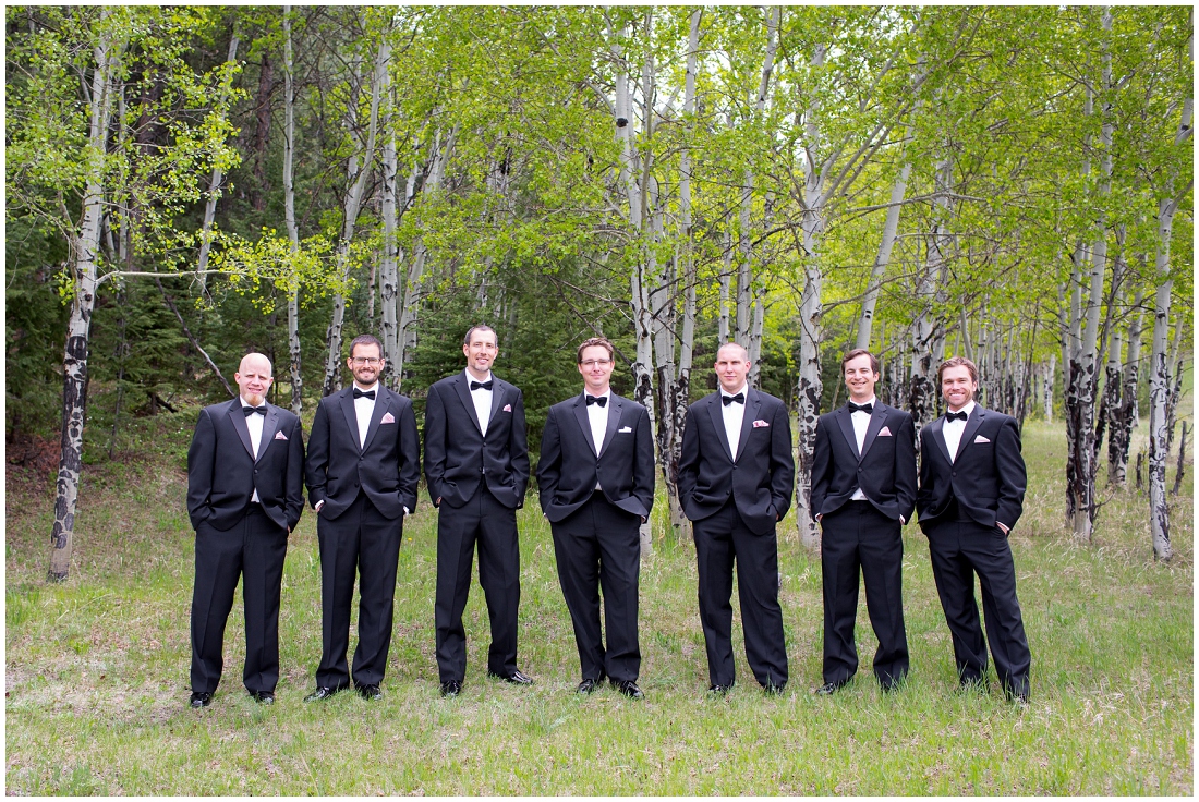 photo of groomsmen in woods
