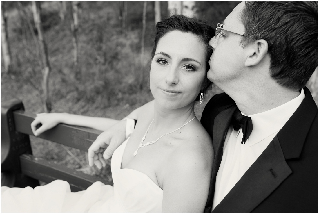 photo of bride and groom on a bench