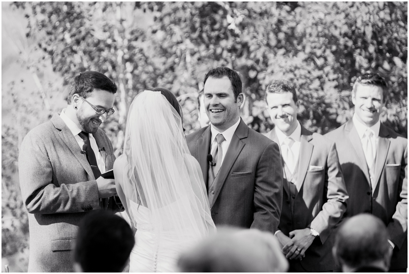 picture of groom laughing during wedding ceremony