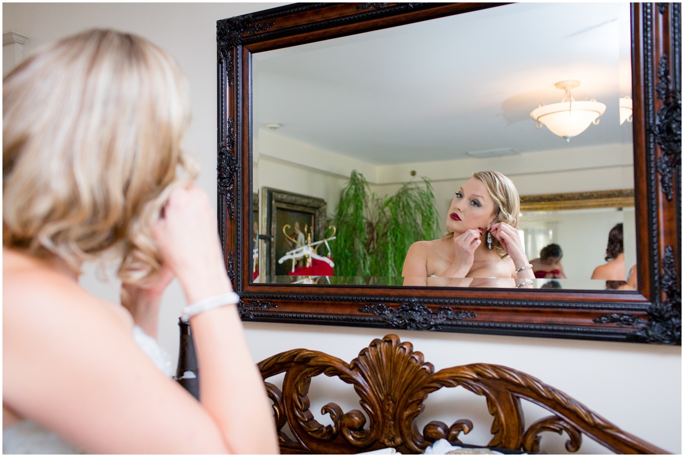 picture of bride looking in the mirror
