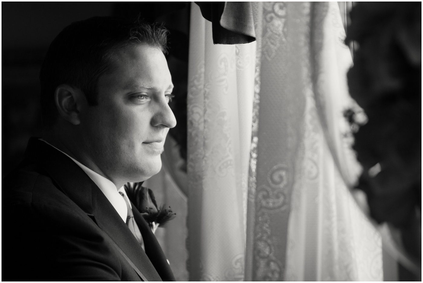 picture of groom in window