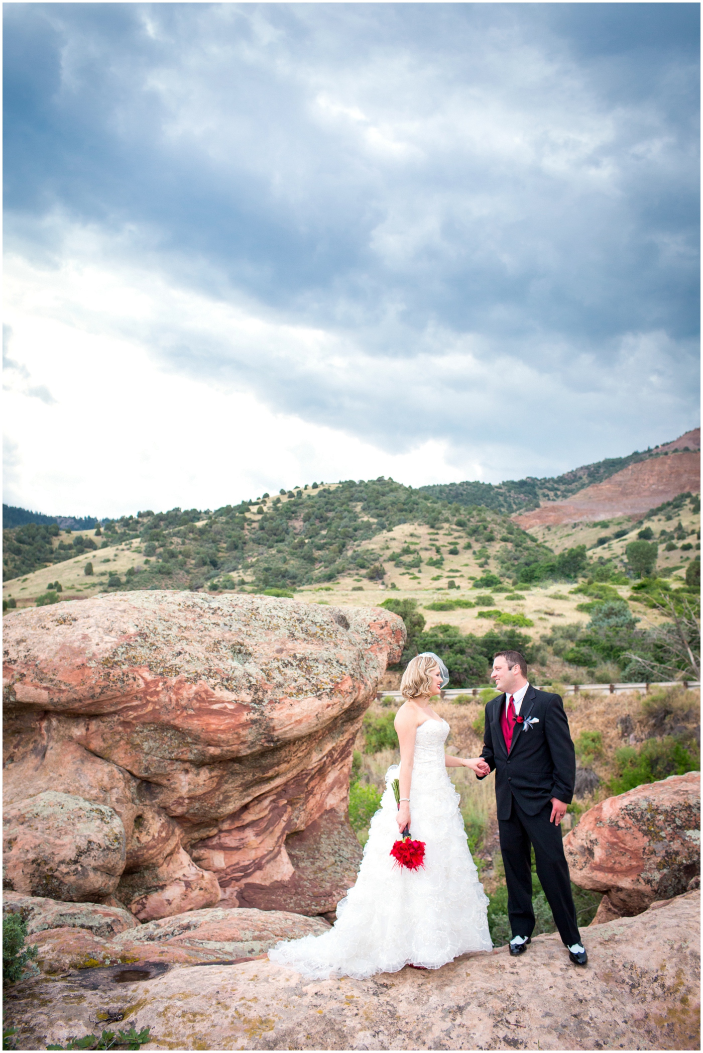 picture of bride and groom on red rocks