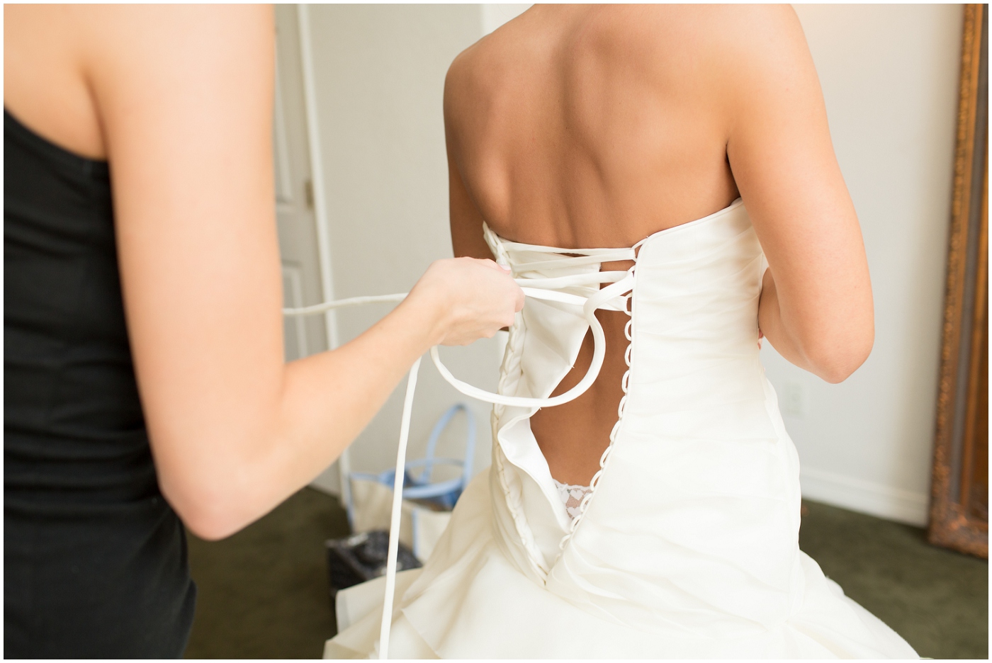 picture of bride putting her dress on
