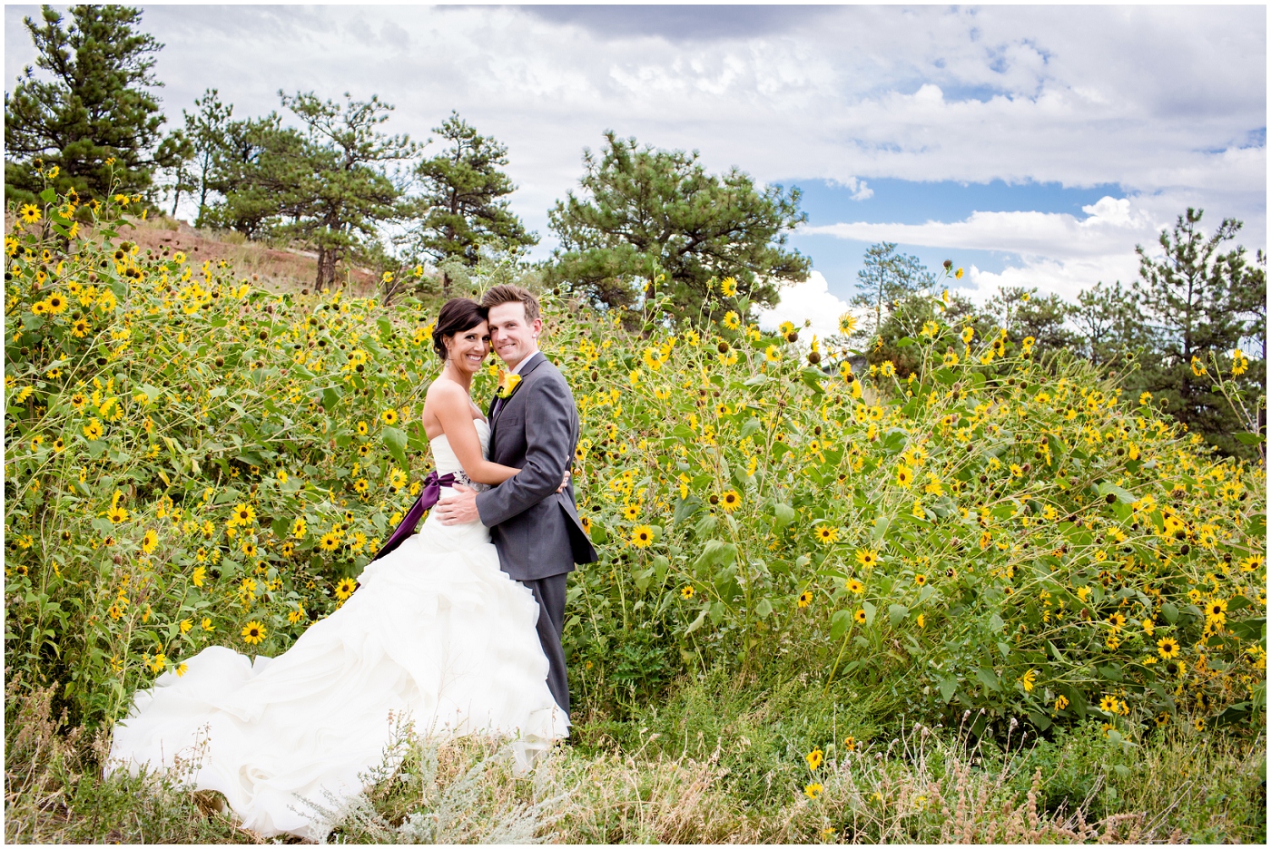 picture of bride and groom in a sunflower field