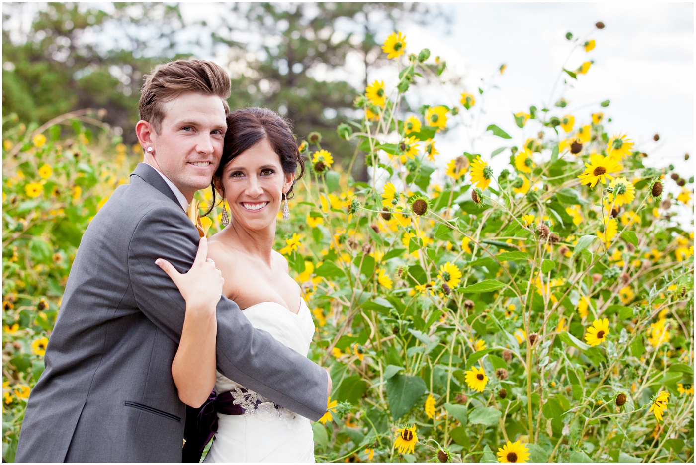 picture of bride and groom in sunflower field