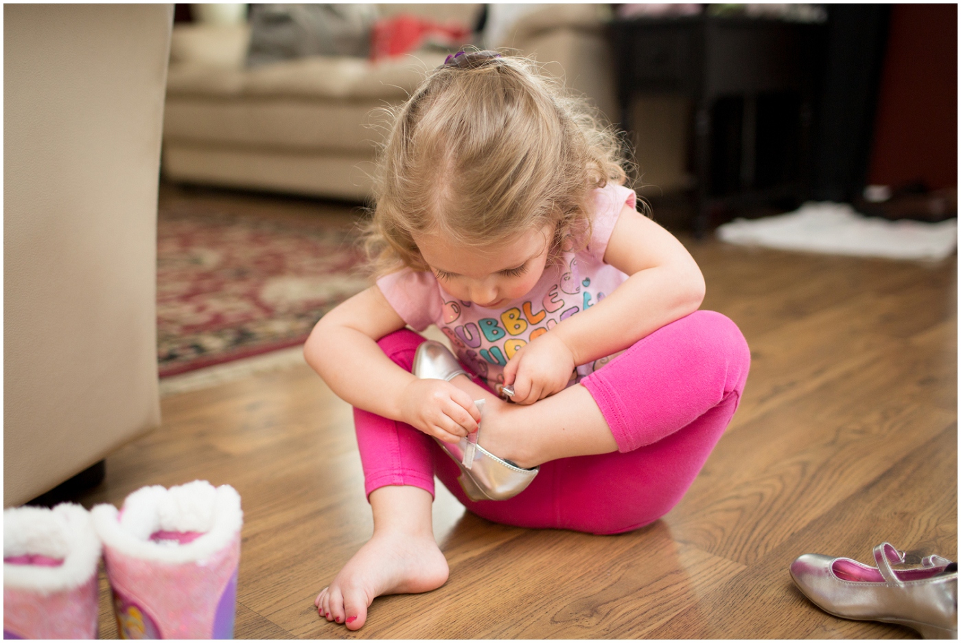 picture of flower girl putting on her shoes