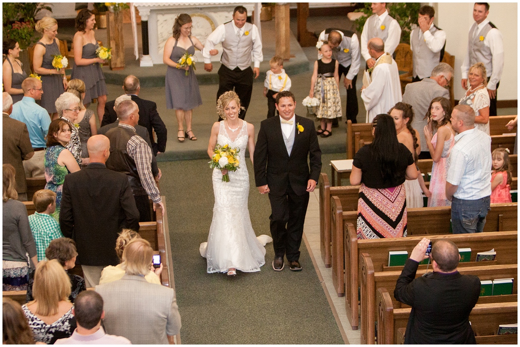 picture of bride and groom walking down the aisle