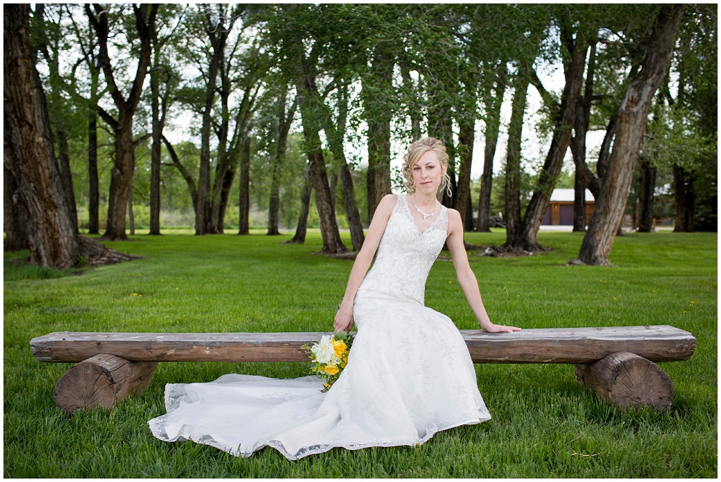 picture of bride sitting on a bench