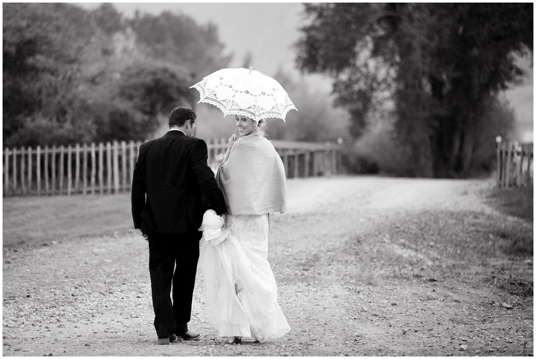 picture of bride and groom walking on dirt road