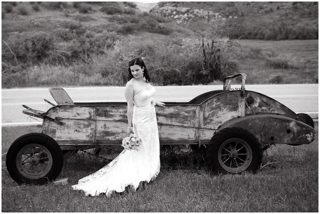 picture of bride with old vehicle