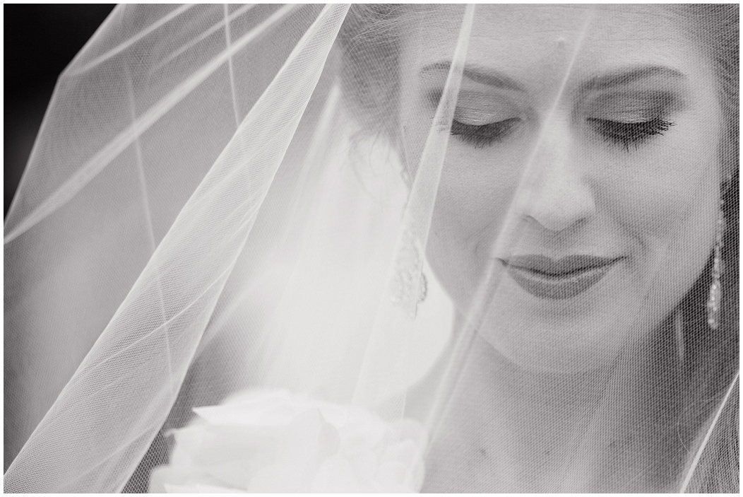picture of bride with veil over her face