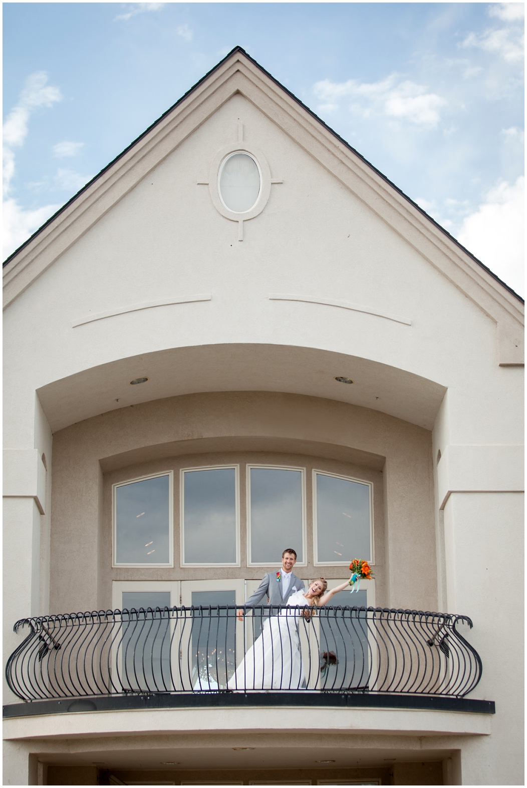picture of bride and groom on a balcony