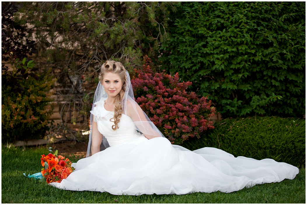 picture of bride sitting in a garden