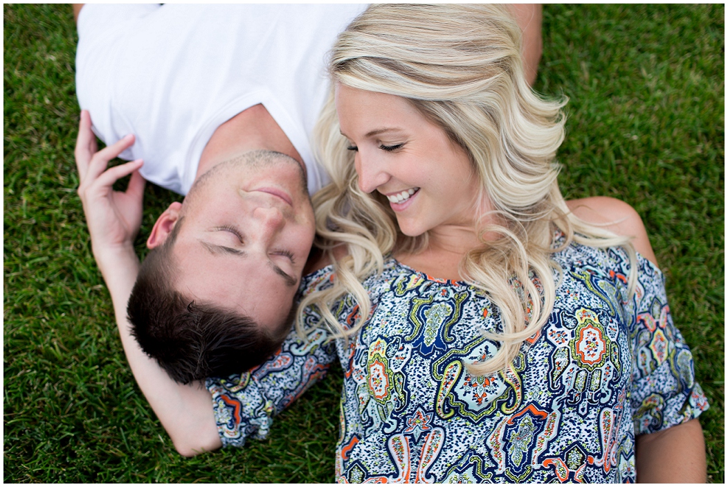 picture of couple laying in the grass