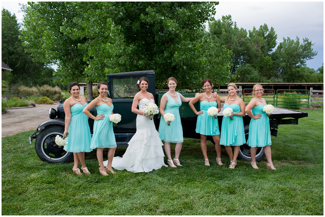 picture of bridesmaids with an old truck