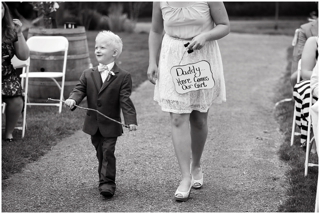 picture of ring bearer with a sign 