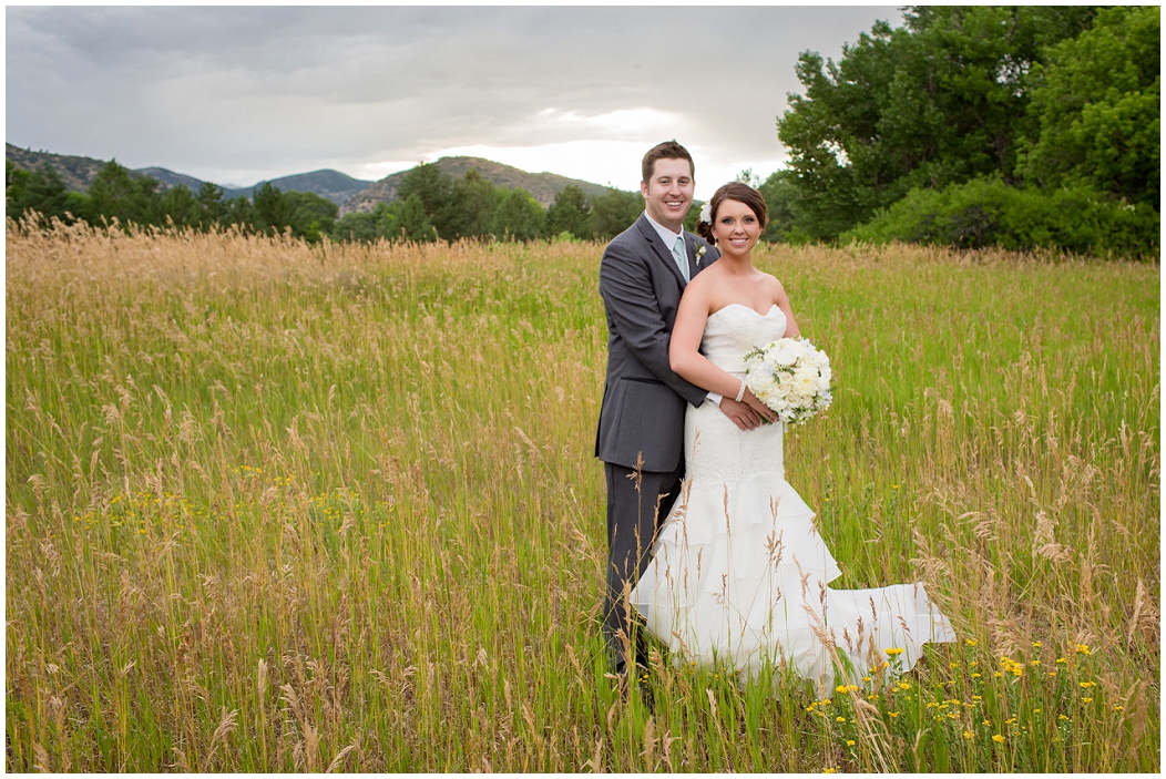 picture of bride and groom in a field