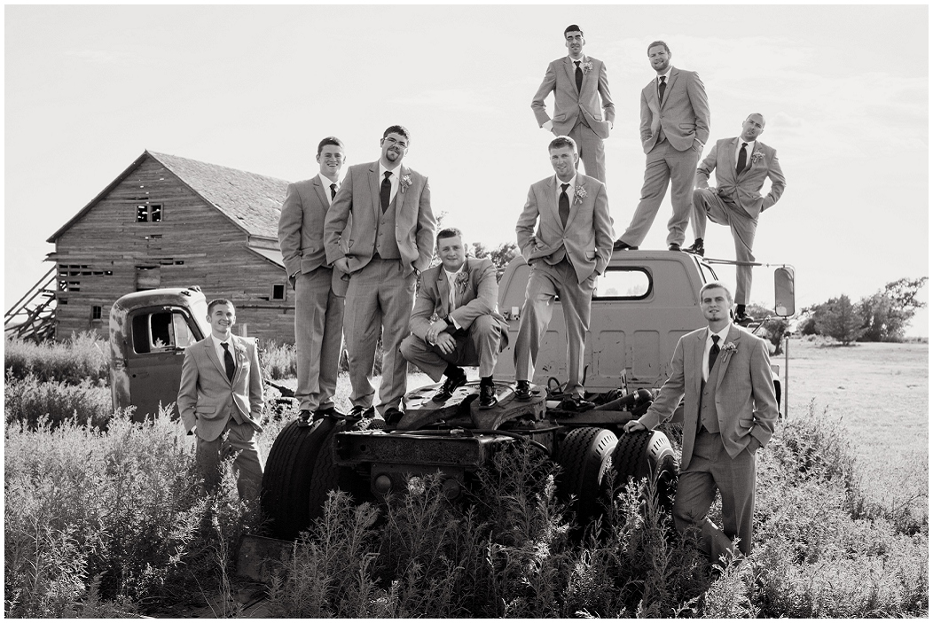 picture of groomsmen on old truck