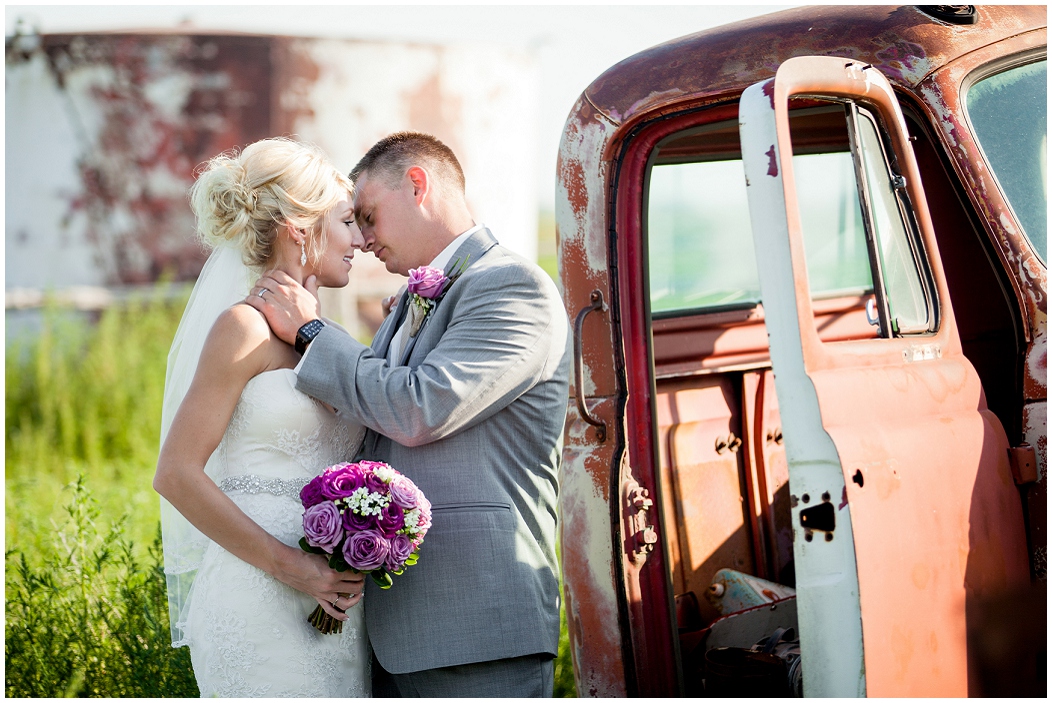 picture of bride and groom with old truck