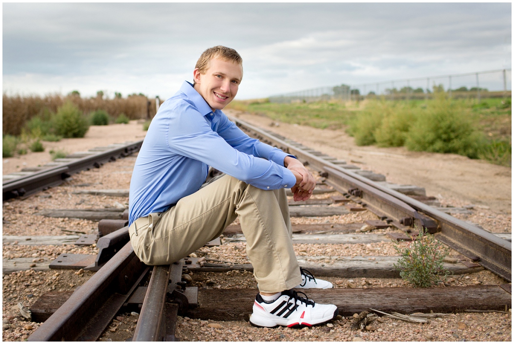 picture of senior boy on railroad tracks
