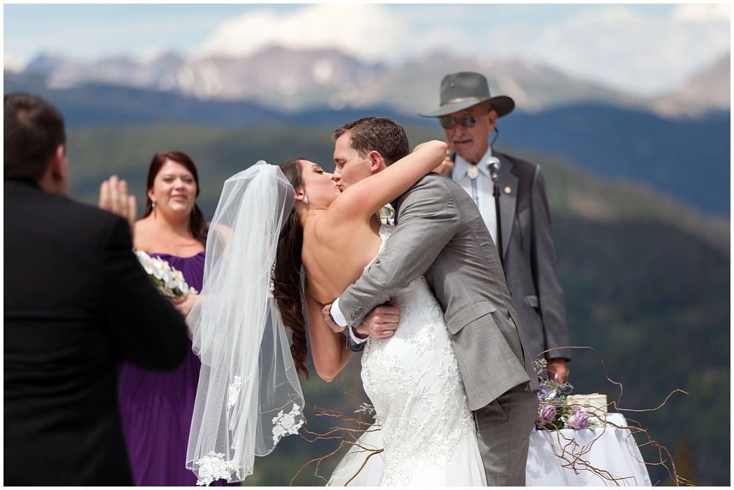 picture of bride and groom's first kiss