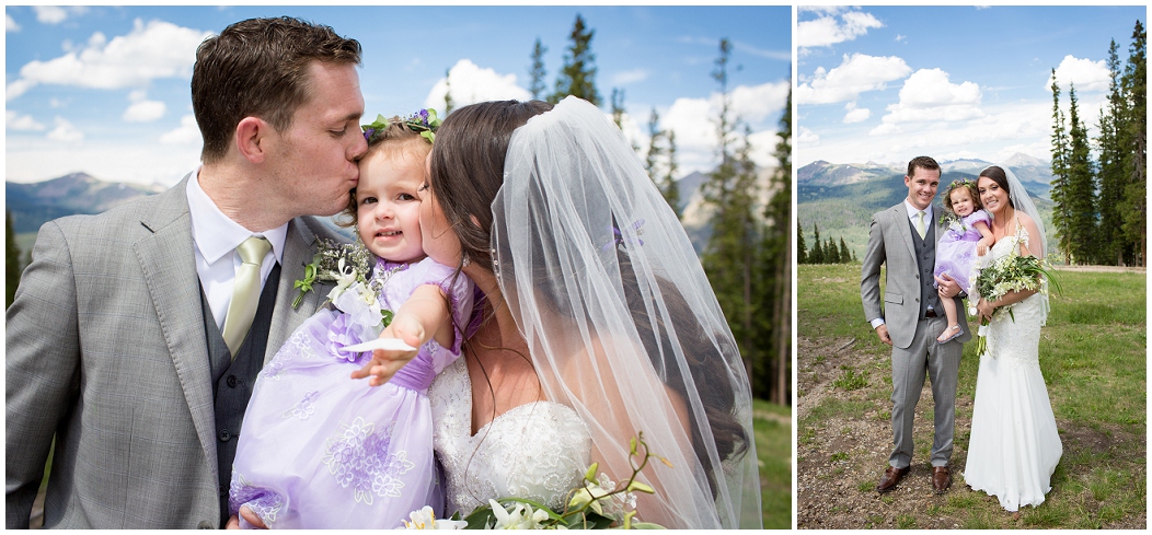 picture of bride and groom kissing daughter