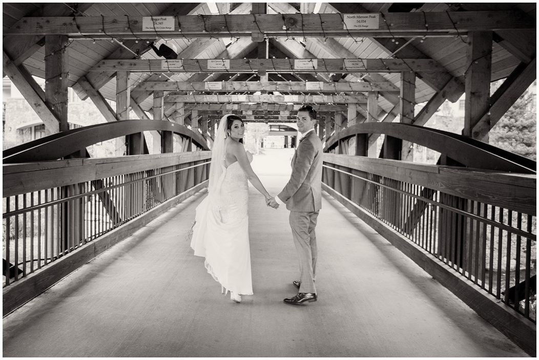 picture of bride and groom on a bridge