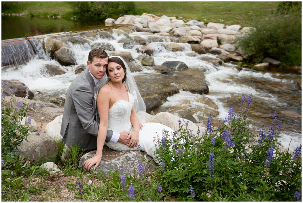 picture of bride and groom by a river