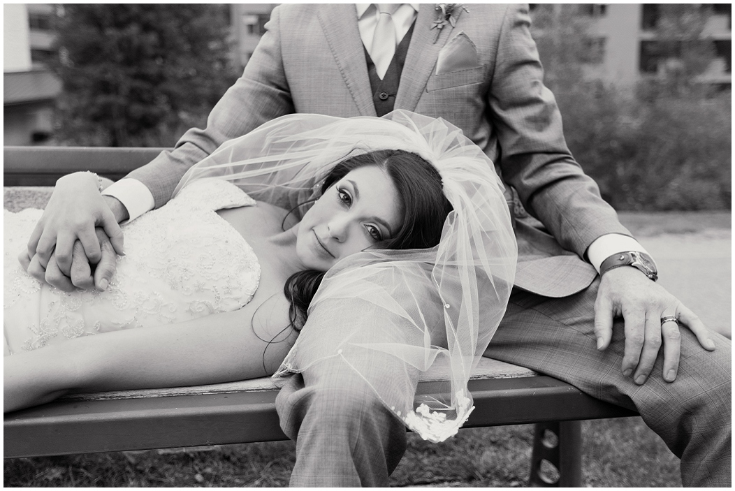picture of bride laying on groom's lap