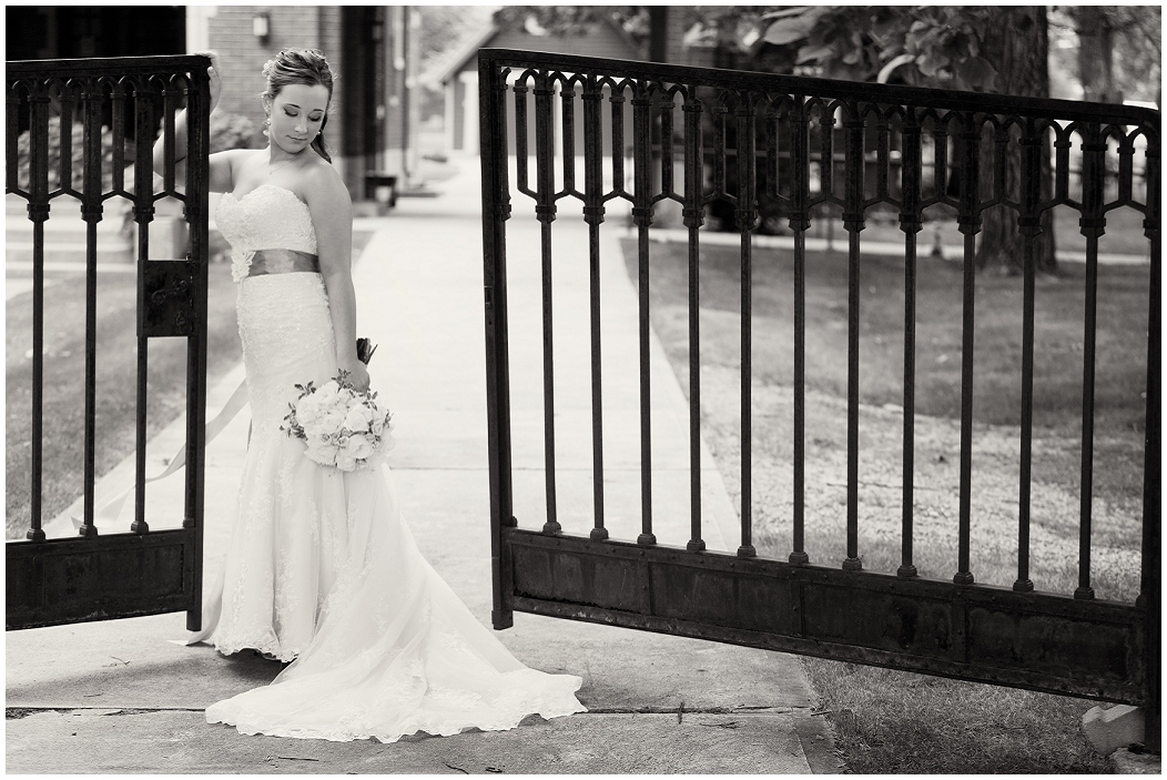 picture of bride with wrought iron gates