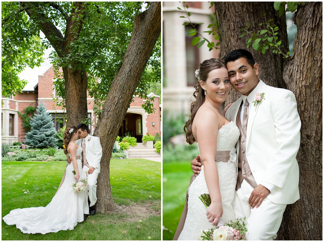 picture of bride and groom against a tree