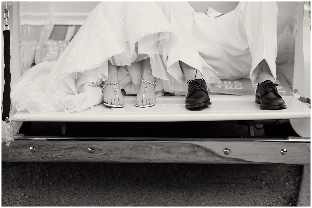 picture of bride and groom laying in a truck