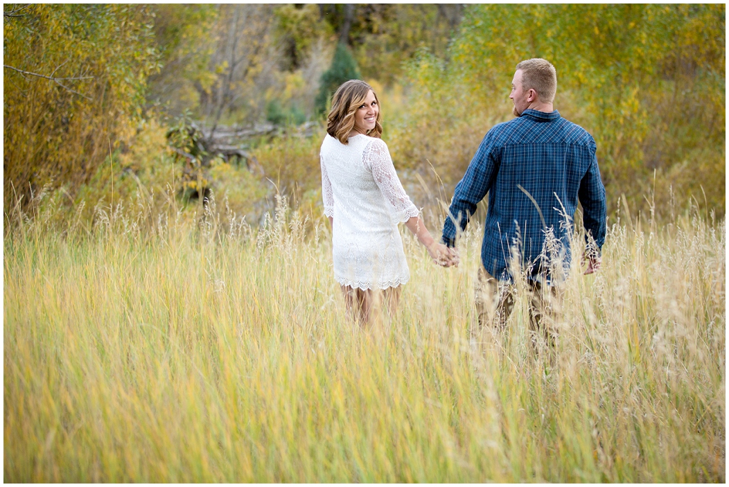 picture of colorado engagement photos in a field