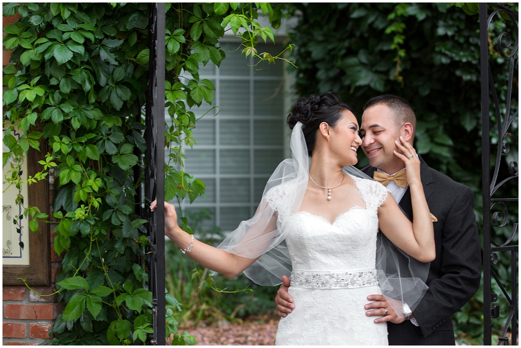 picture of bride and groom with wrought iron gates