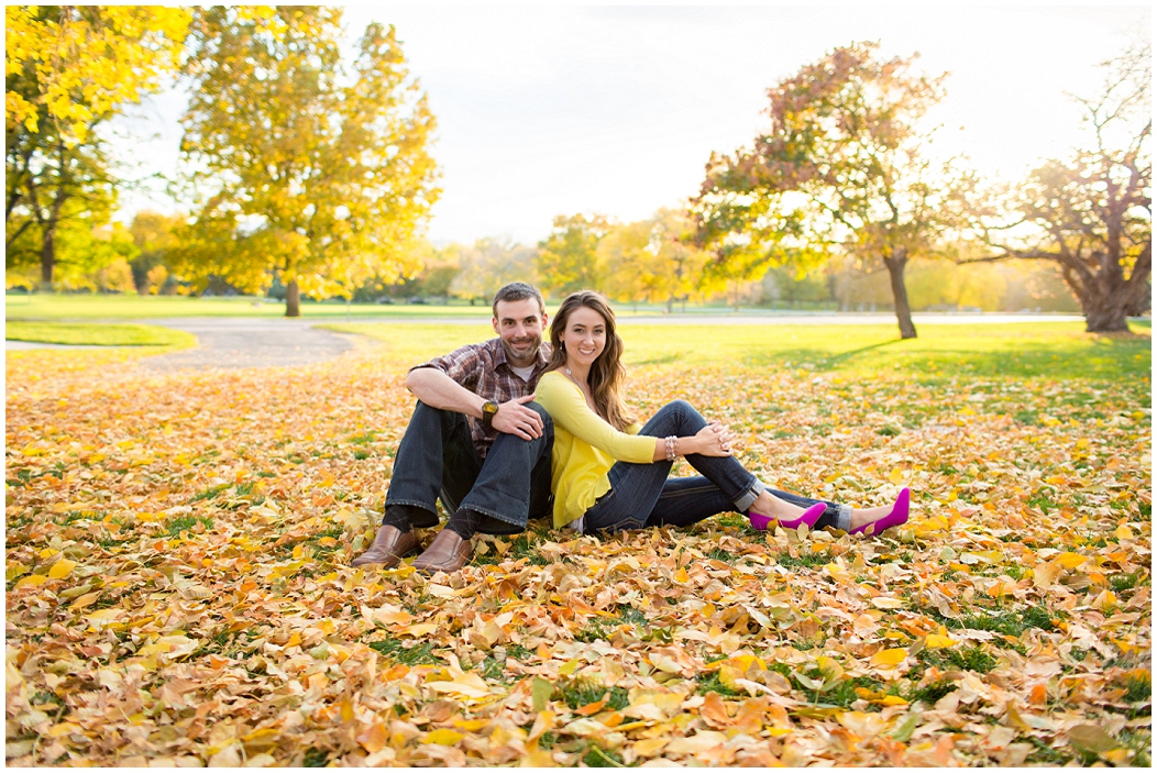 picture of couple sitting in leaves
