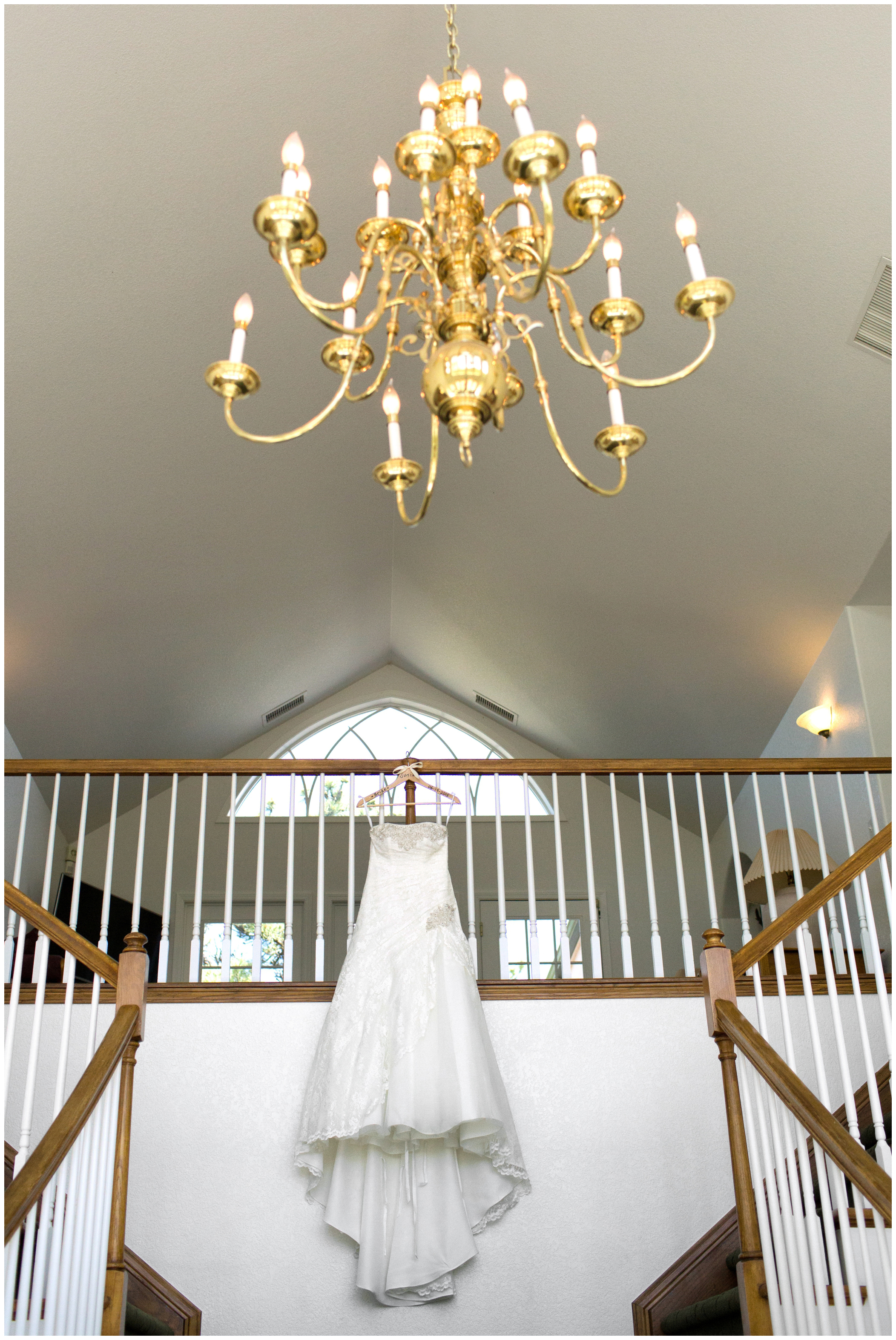 picture of bridal gown hanging on staircase
