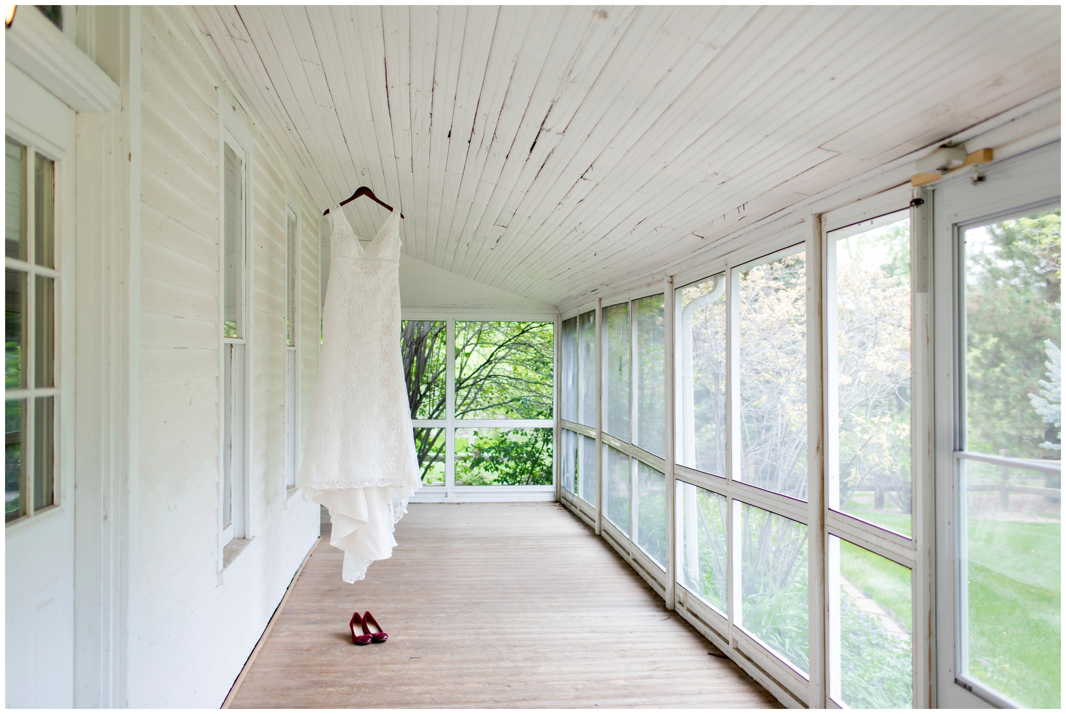 picture of bridal gown hanging on rustic house