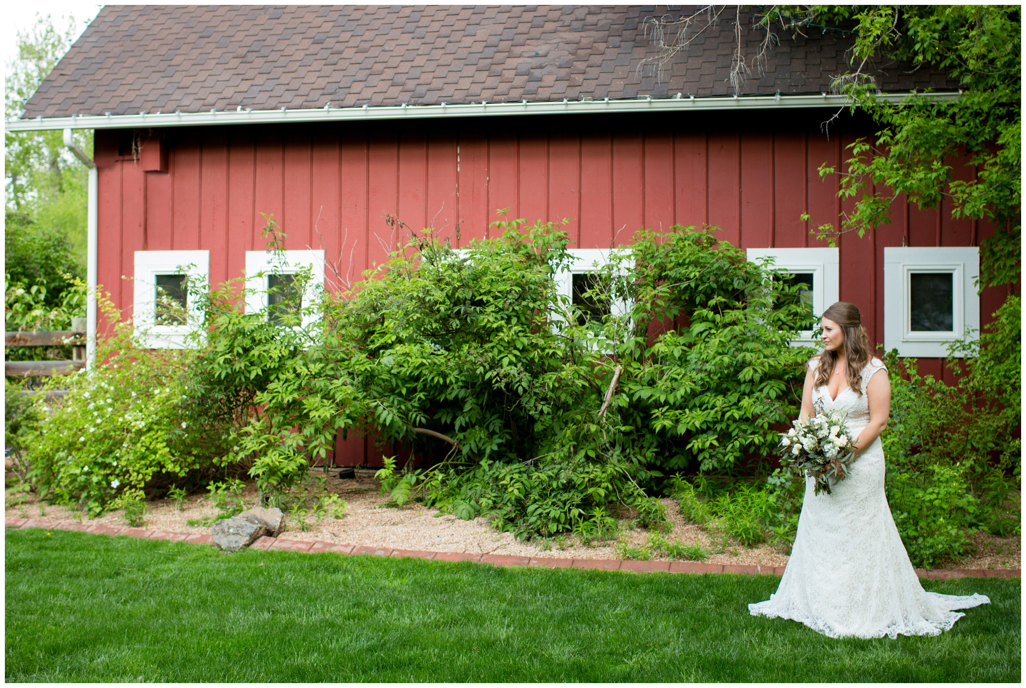 picture of bride by red barn 