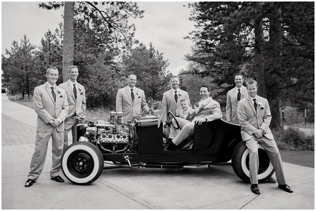 picture of groom and groomsmen with vintage car
