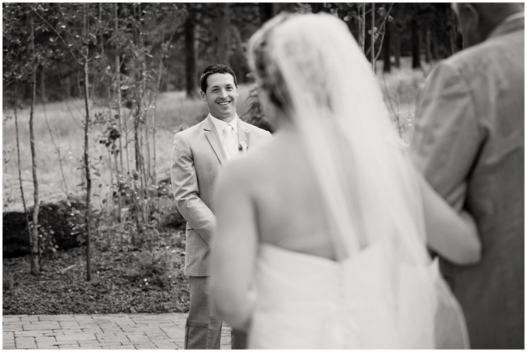 picture of groom's reaction as bride walks down the aisle