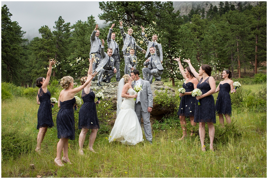 picture of bridal party throwing rose petals