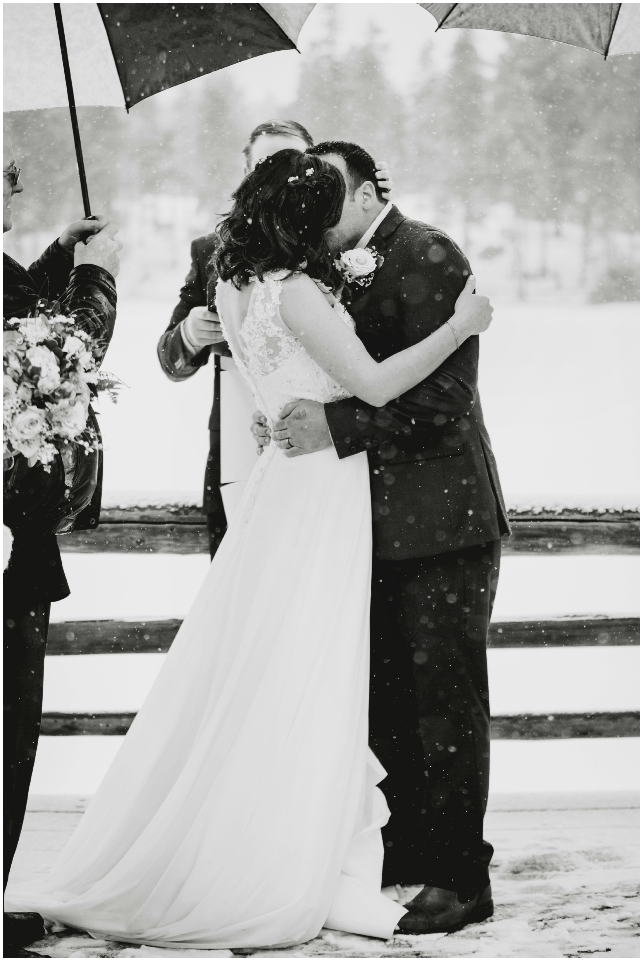 first kiss at Colorado winter wedding ceremony 