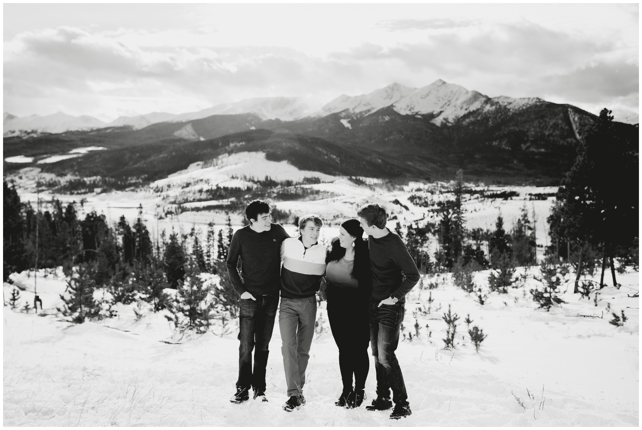 Breckenridge family photography during winter with snowy mountains in the background