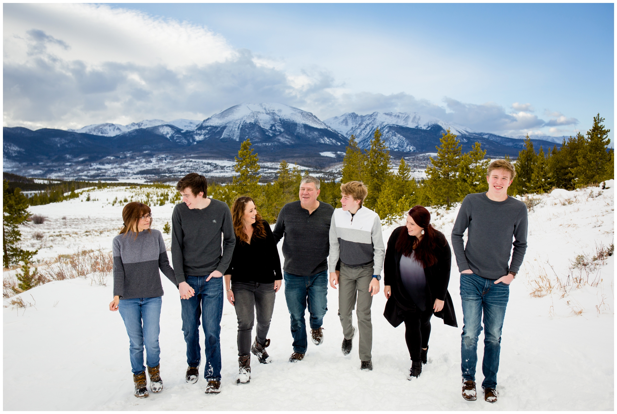 family walking in the snow during Breckenridge winter family photography session 