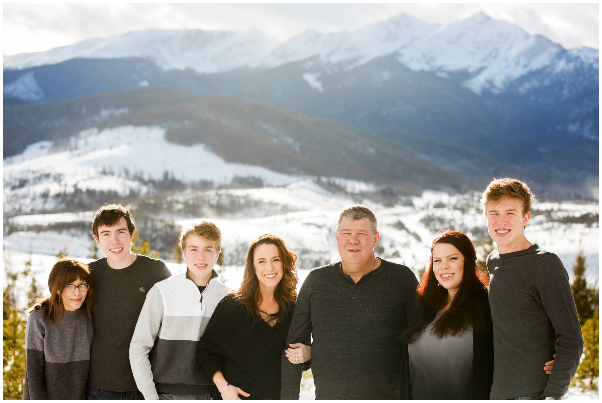 snowy Colorado winter family photos of adult family at Sapphire Point Overlook