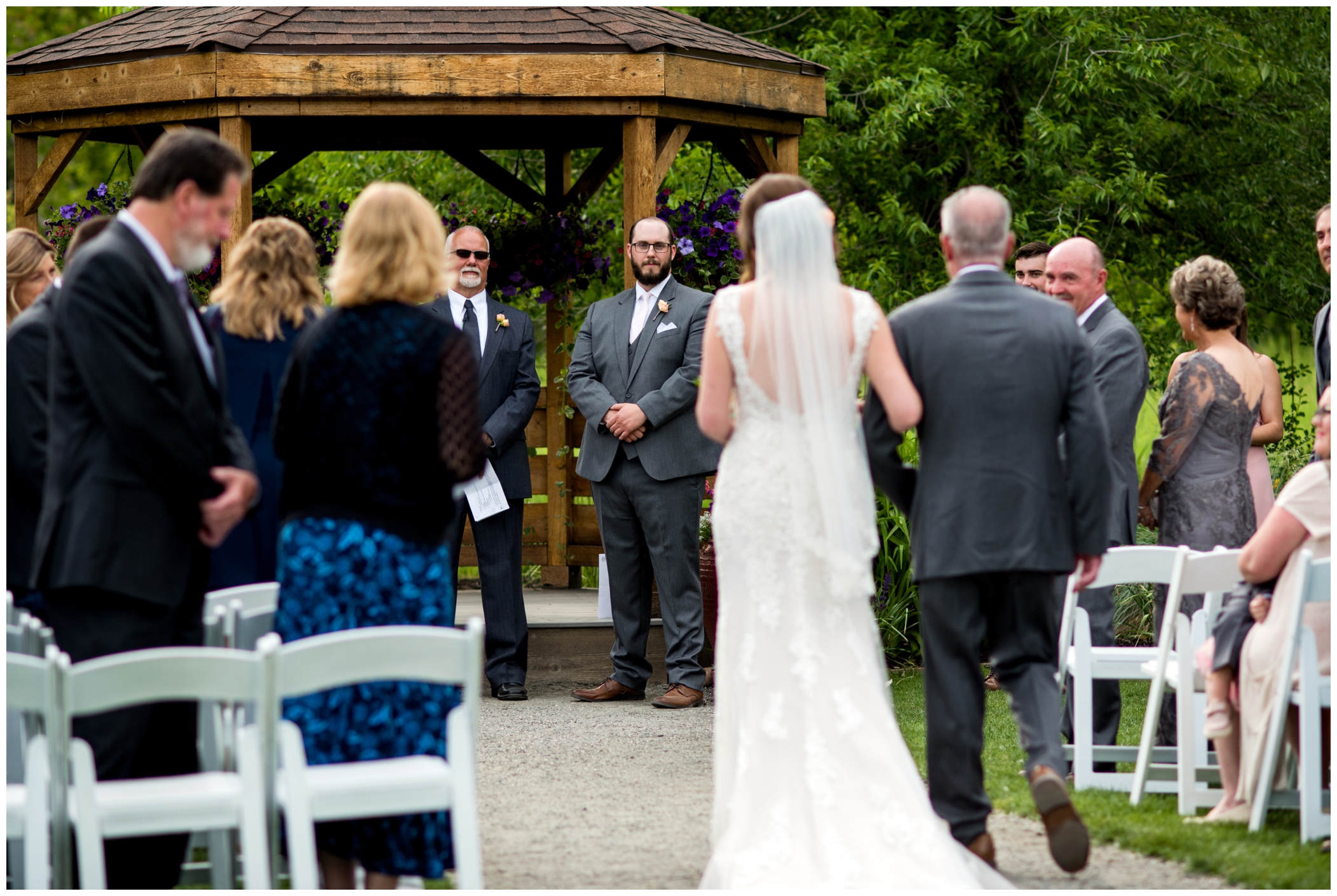 groom seeing bride walk down aisle at Chatfield Farms Denver wedding 